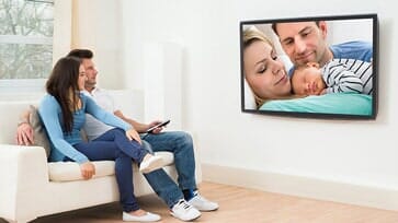 Couple watching telivision — Couple in Carlsbad, CA Couple watching telivision — Couple in Carlsbad, CA