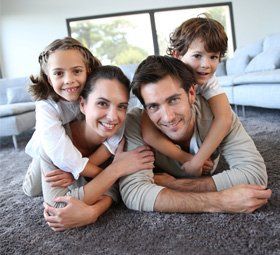 family laying on floor