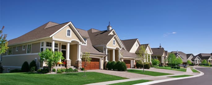 Neighborhood with green lawns and large single-family homes