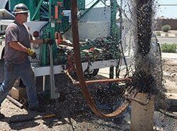 Worker Using Water Pump — Mesa, AZ — Arizona Preston Drilling LLC