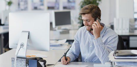 man in front of a computer