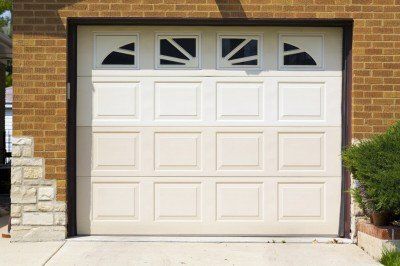 white garage door — Garage Doors in Wagener, SC A garage door in Augusta, GA