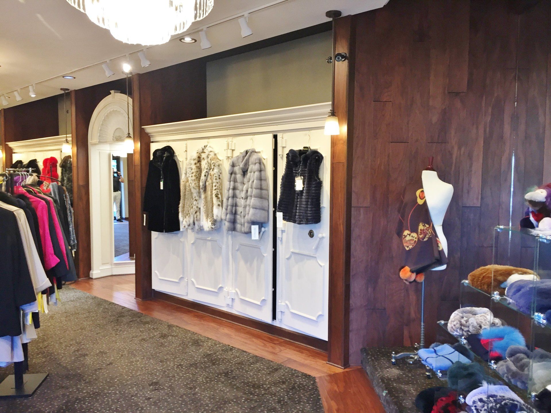 A clothes store with a lot of clothes on display
