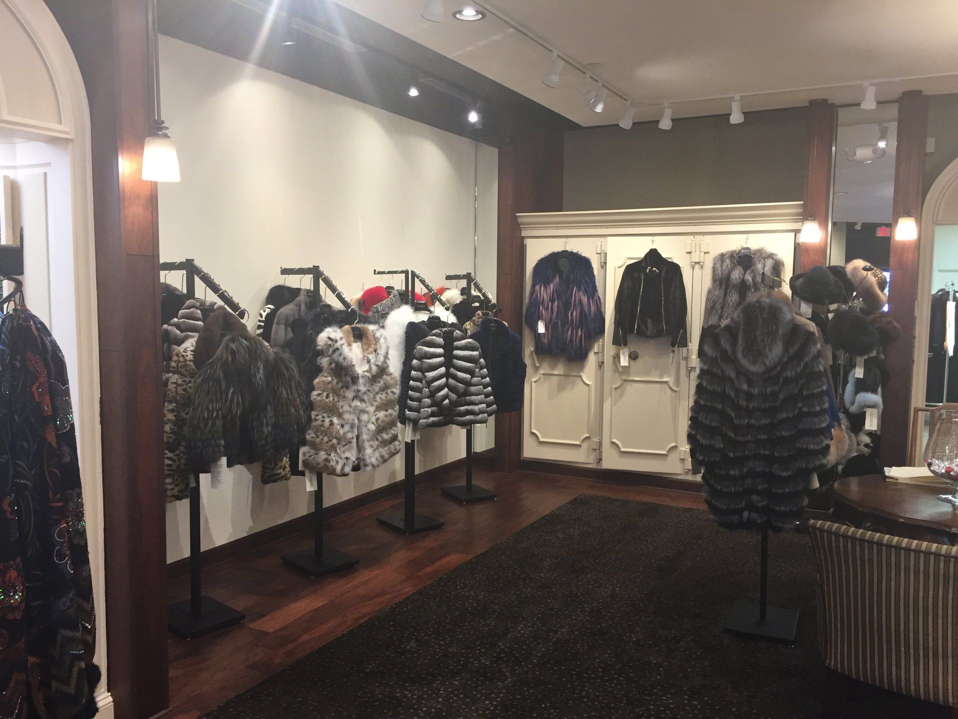 A store with a lot of fur coats on display