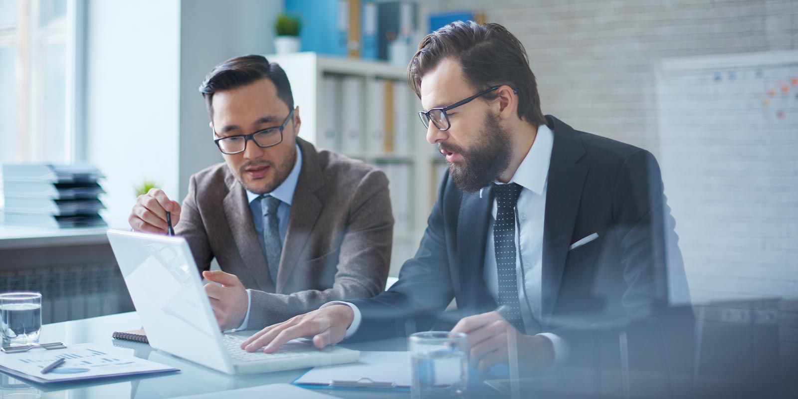Senior Happy Couple Shaking Hand With Financial Advisor