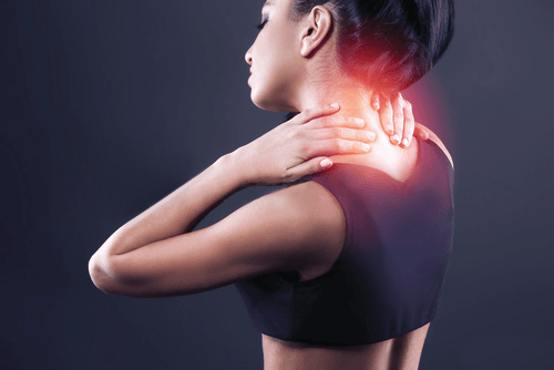 Female in upper back pain