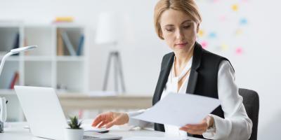 woman looking over documents