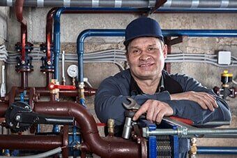 Plumber Holding Wrench - Pump Contractor in Batavia, IL Plumber Holding Wrench - Pump Contractor in Batavia, IL