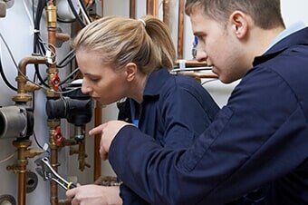Team of Male and Female Inspectors - Pump Contractor in Batavia, IL Team of Male and Female Inspectors - Pump Contractor in Batavia, IL