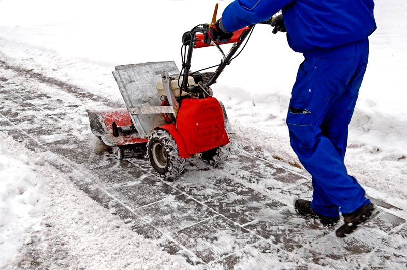 Man Using Snow Blower — Columbus, OH — CBJ Landscape Group Man Using Snow Blower — Columbus, OH — CBJ Landscape Group