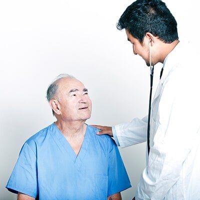 Doctor Checking His Senior Patient — Neurologists in St. Petersburg, FL Doctor Checking His Senior Patient — Neurologists in St. Petersburg, FL