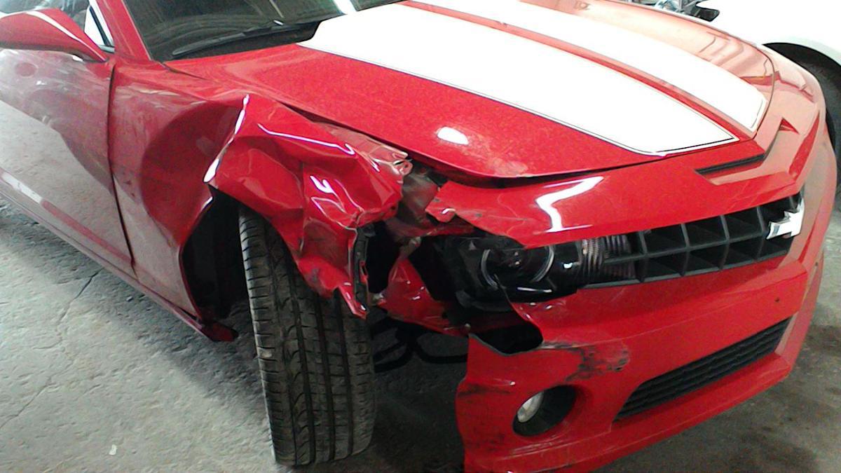 red Chevy with front end damage
