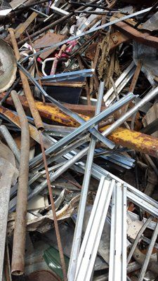 A pile of scrap metal is sitting on top of each other on a table.