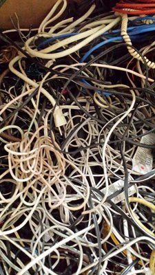 A pile of wires and cables are stacked on top of each other.