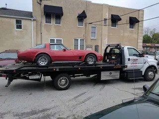 Red Car in Towing Truck | Elkton, MD | Extreme Towing LLC