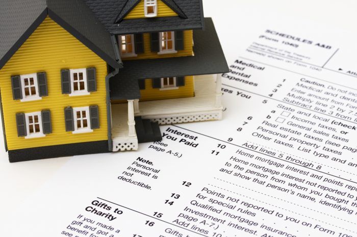 small house above papers