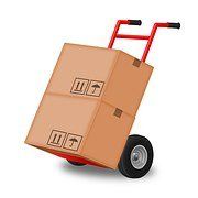 A red hand truck dolly loaded with two stacked cardboard boxes, isolated on a white background.