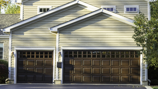 A house with two garage doors and a driveway