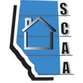 A blue and black logo with a house on it.
