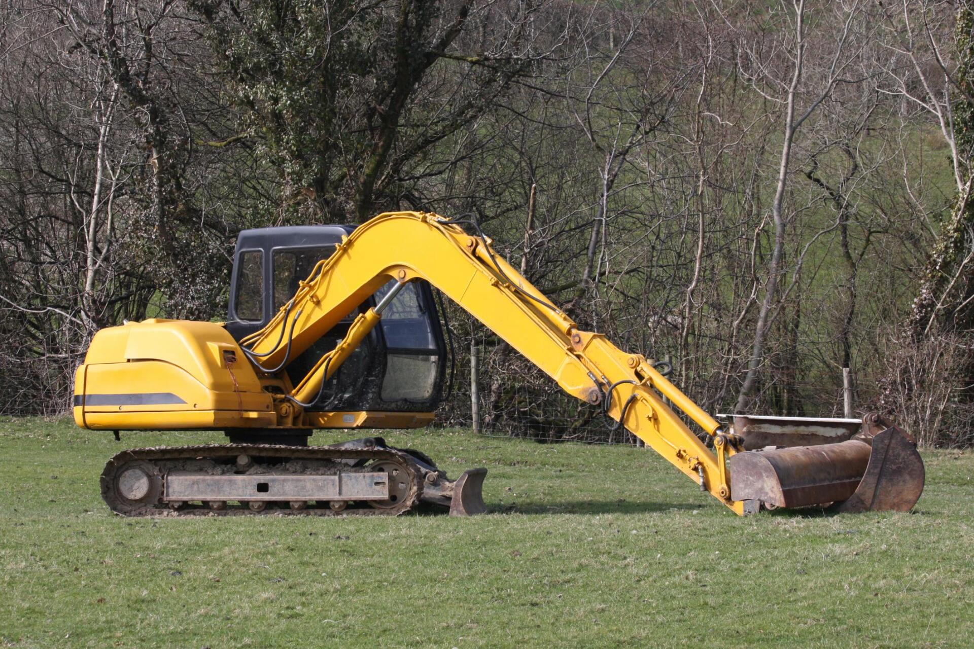 a backhoe truck on the field