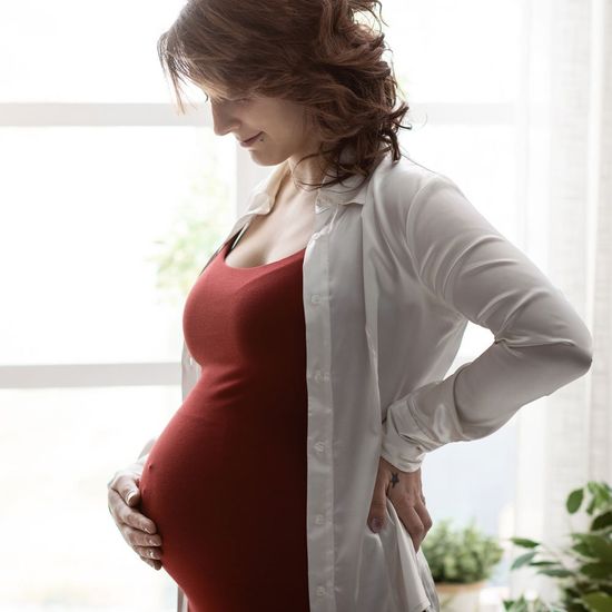 Pregnant Woman on Red Dress — Saginaw, MI — Swartz Adoption Agency Pregnant Woman on Red Dress — Saginaw, MI — Swartz Adoption Agency