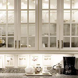 White Cabinets With Glass Panel Shelves — Wilmington, NC — The Cabinet Gallery White Cabinets With Glass Panel Shelves — Wilmington, NC — The Cabinet Gallery
