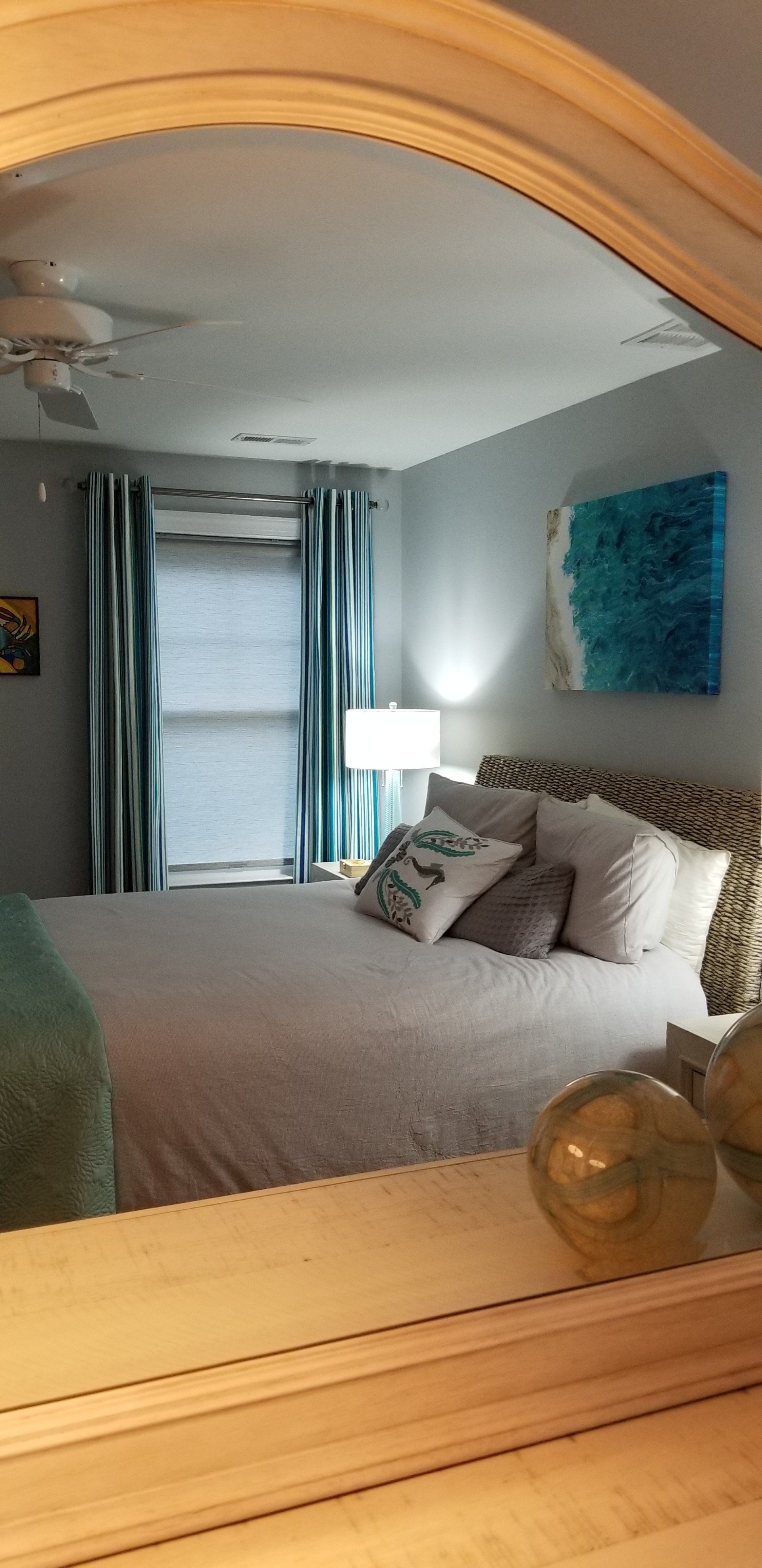 bedroom with turquoise curtains