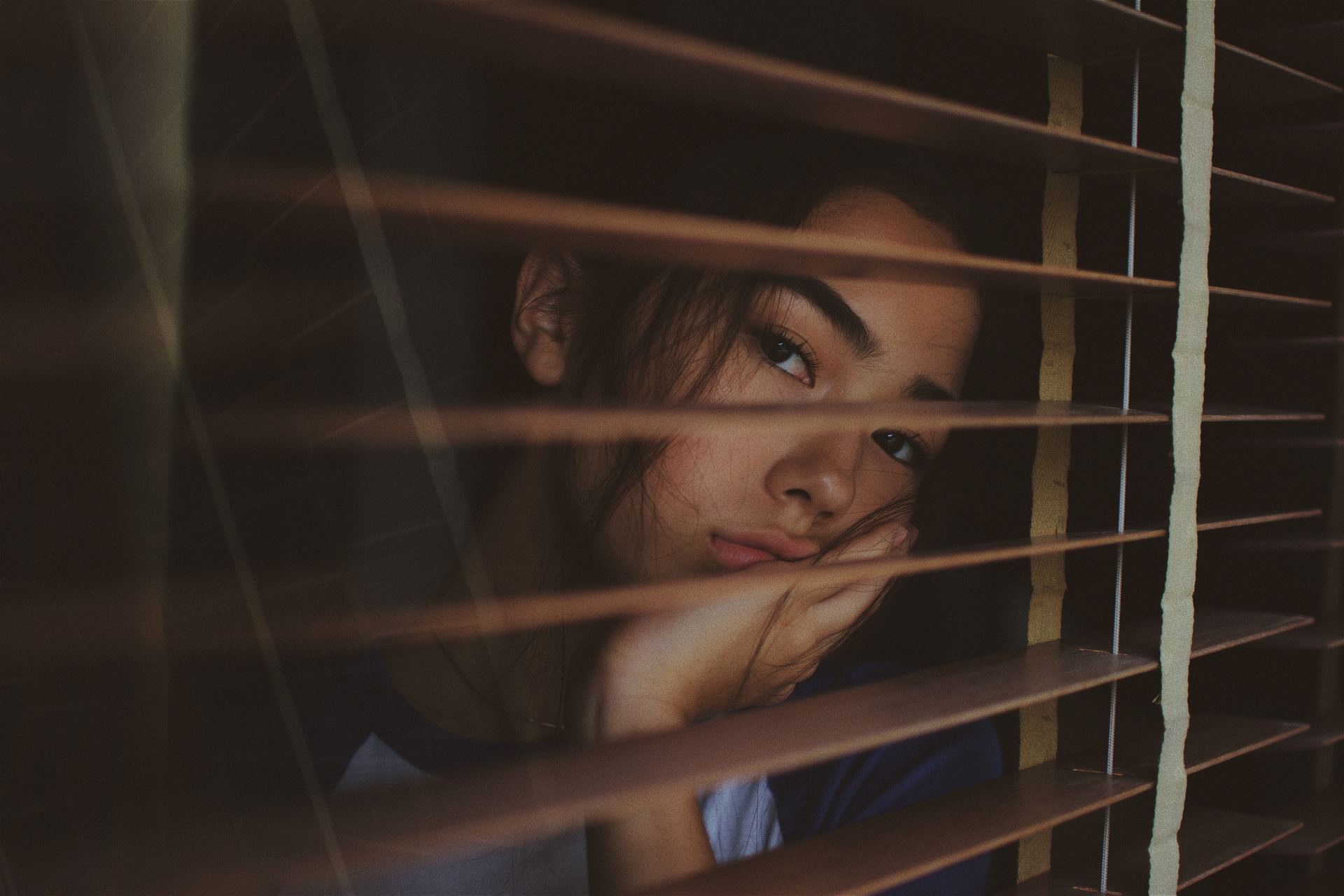 girl looking out window