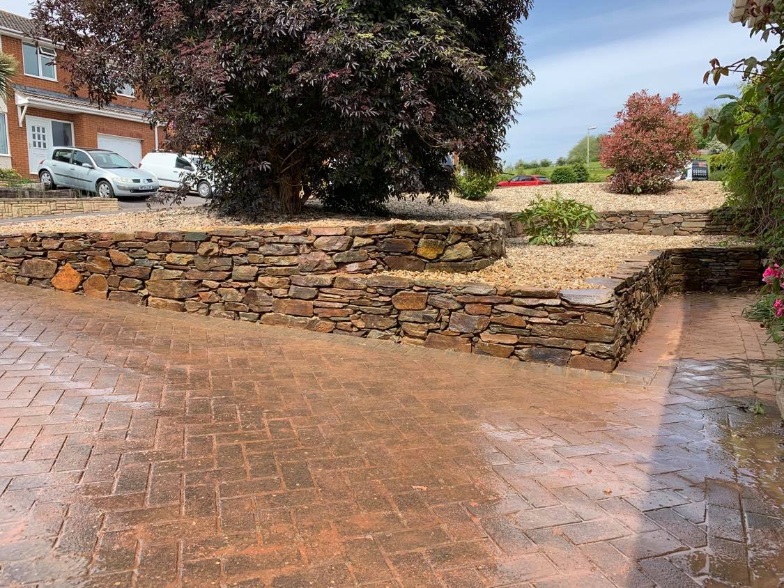 Natural stone landscaping in home garden with stairs