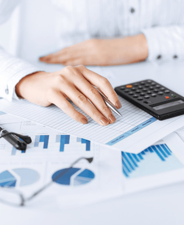 picture of woman hand with calculator and papers