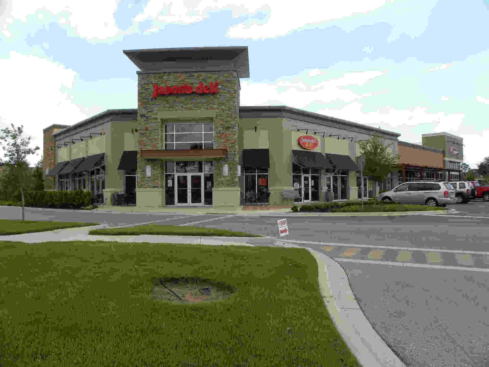 Front View of a Green and White-colored Building — Closers in Brandon, FL