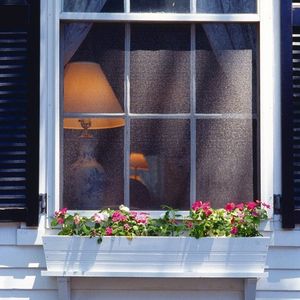house window with flowerbox house window with flowerbox