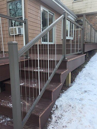 This Is An Azek Deck With Plugs Covering All Screws For A Smooth Deck Surface And A Aluminum Key Link — Decking Services in Wyncote, PA