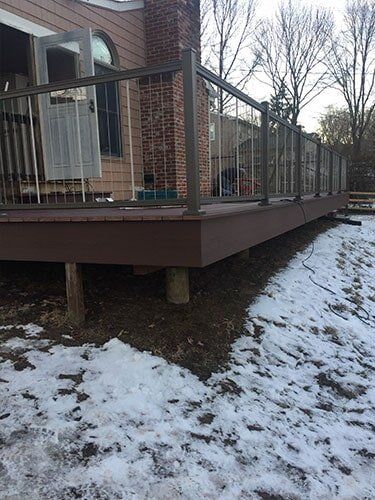 This Is An Azek Deck With Plugs Covering All Screws For A Smooth Deck Surface And A Aluminum Key Link — Decking Services in Wyncote, PA
