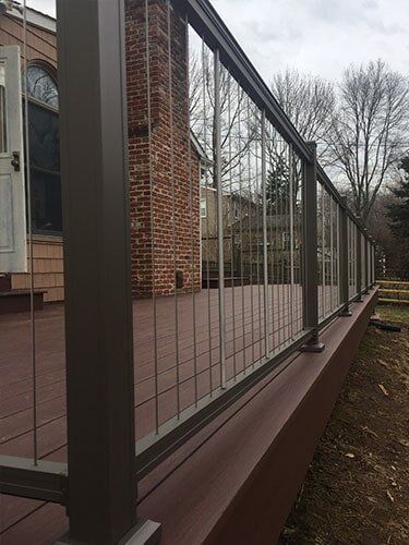 This Is An Azek Deck With Plugs Covering All Screws For A Smooth Deck Surface And A Aluminum Key Link — Decking Services in Wyncote, PA