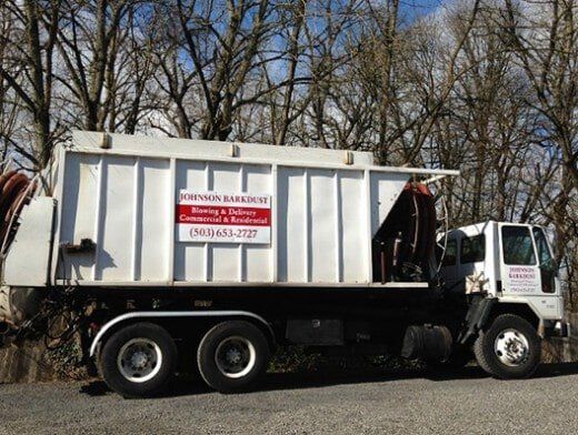 Johnson Barkdust Truck — Top-Quality Hemlock & Red Fir Barkdust In Milwaukie, OR Johnson Barkdust Truck — Top-Quality Hemlock & Red Fir Barkdust In Milwaukie, OR