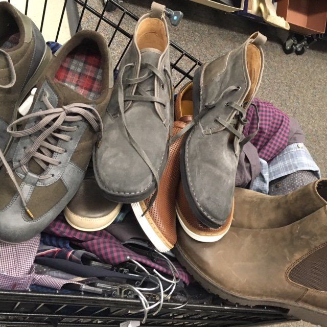 A bunch of shoes are stacked on top of each other