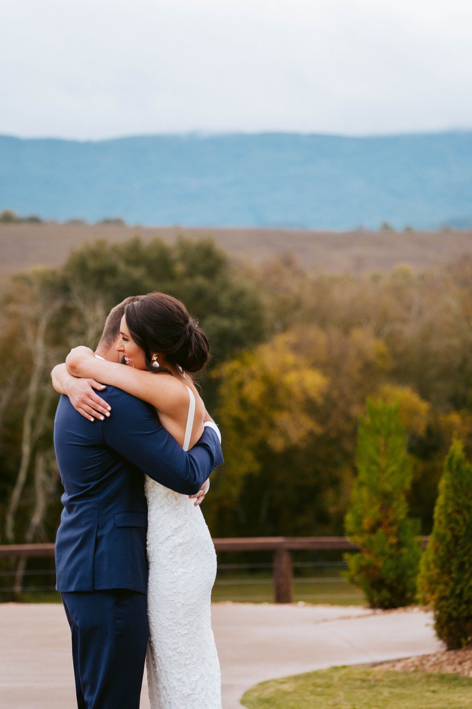 Bride and groom kissing in front of a Rolls Royce at Howe Farms near Chattanooga, TN, Chattanooga Wedding Photographer