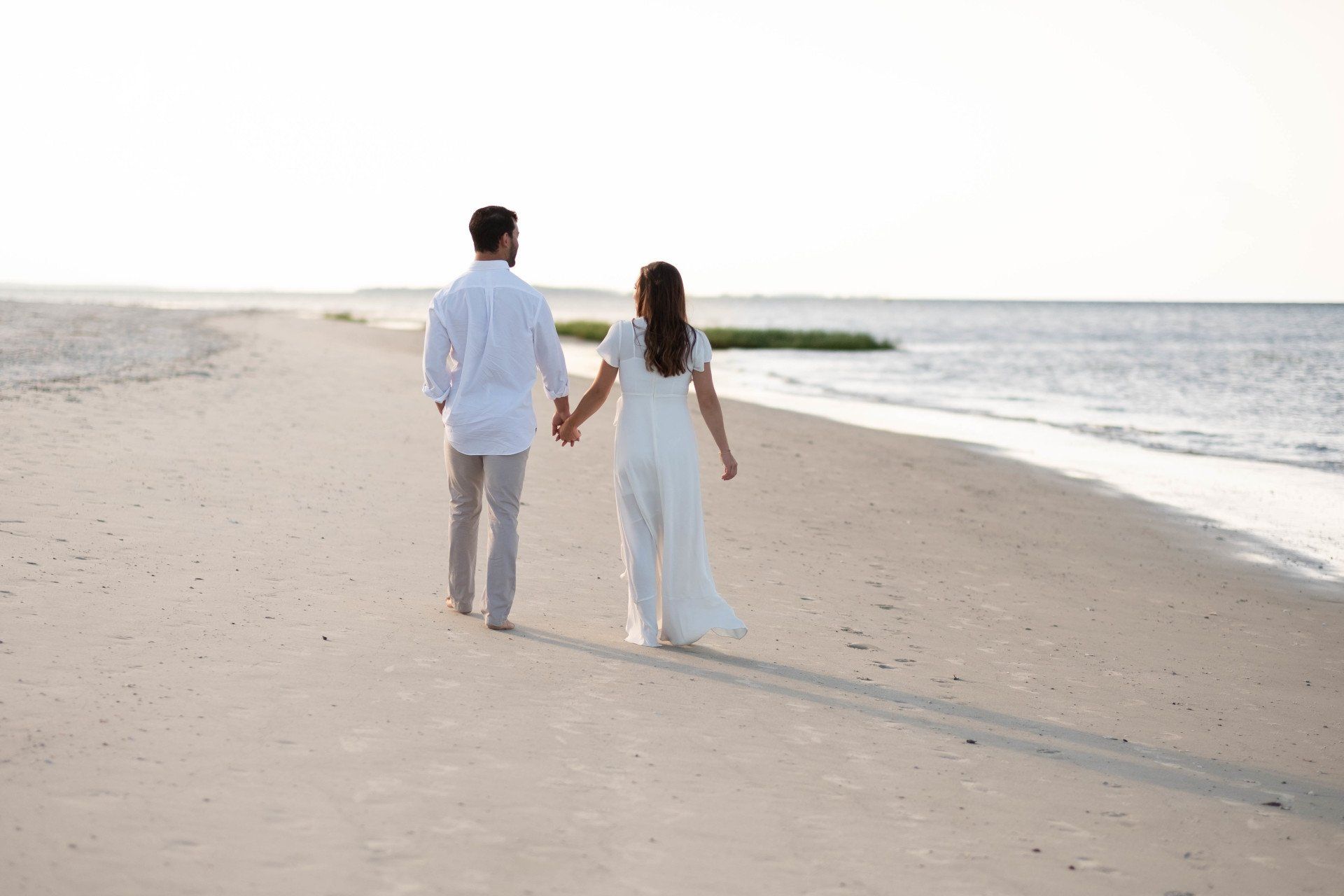 couple walking along the beach in Hilton Head