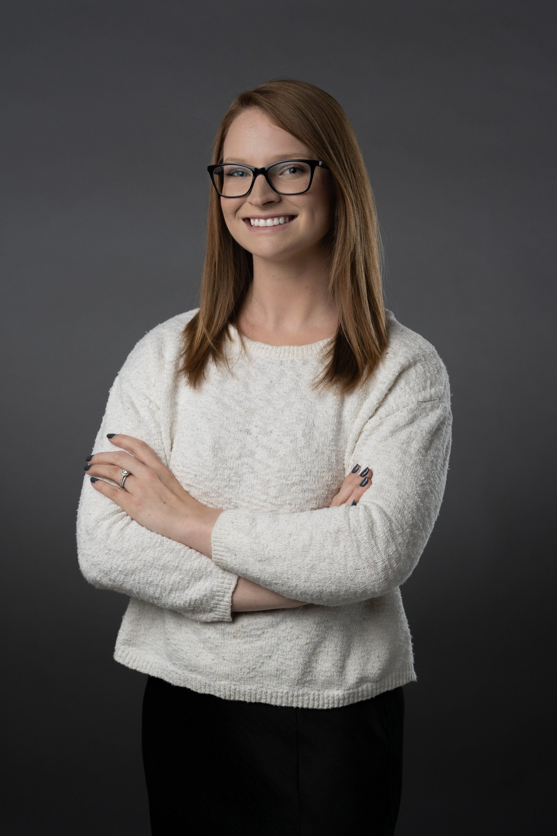 Studio style headshot of professional women with glasses