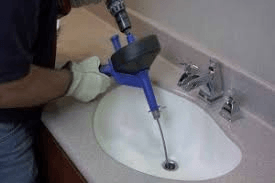 Blocked Sink Being Cleaned