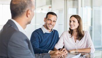 Auto Insurance — Couple Talking to an Agent in Orlando, FL
