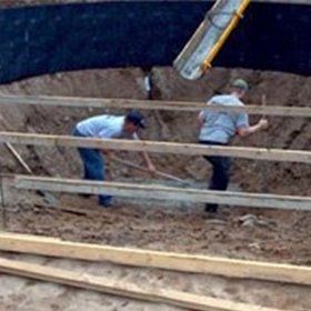 Men Pouring Concrete — Kalamazoo, MI — Mark’s Pool Services LLC