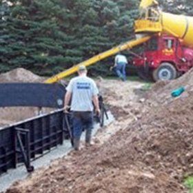 Men Near Poured Concrete — Kalamazoo, MI — Mark’s Pool Services LLC