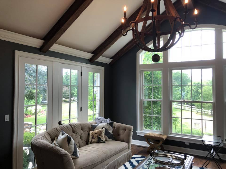 A living room with a couch and a chandelier