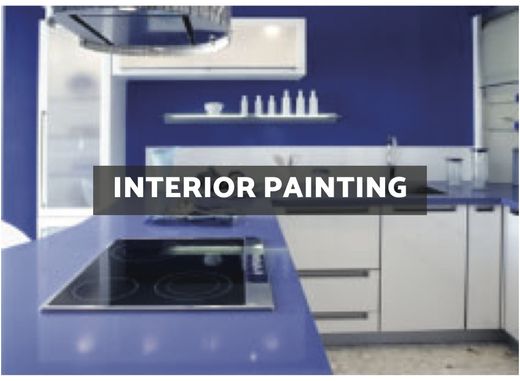 A kitchen with blue walls and white cabinets and a stove top oven.