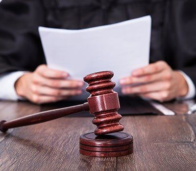 Judge Holding Documents — Grandville attorney in Grandville, MI Judge Holding Documents — Grandville attorney in Grandville, MI