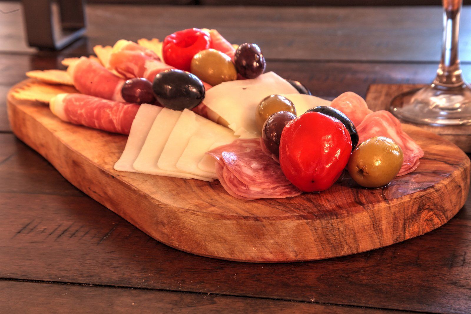 A wooden cutting board with a variety of food on it