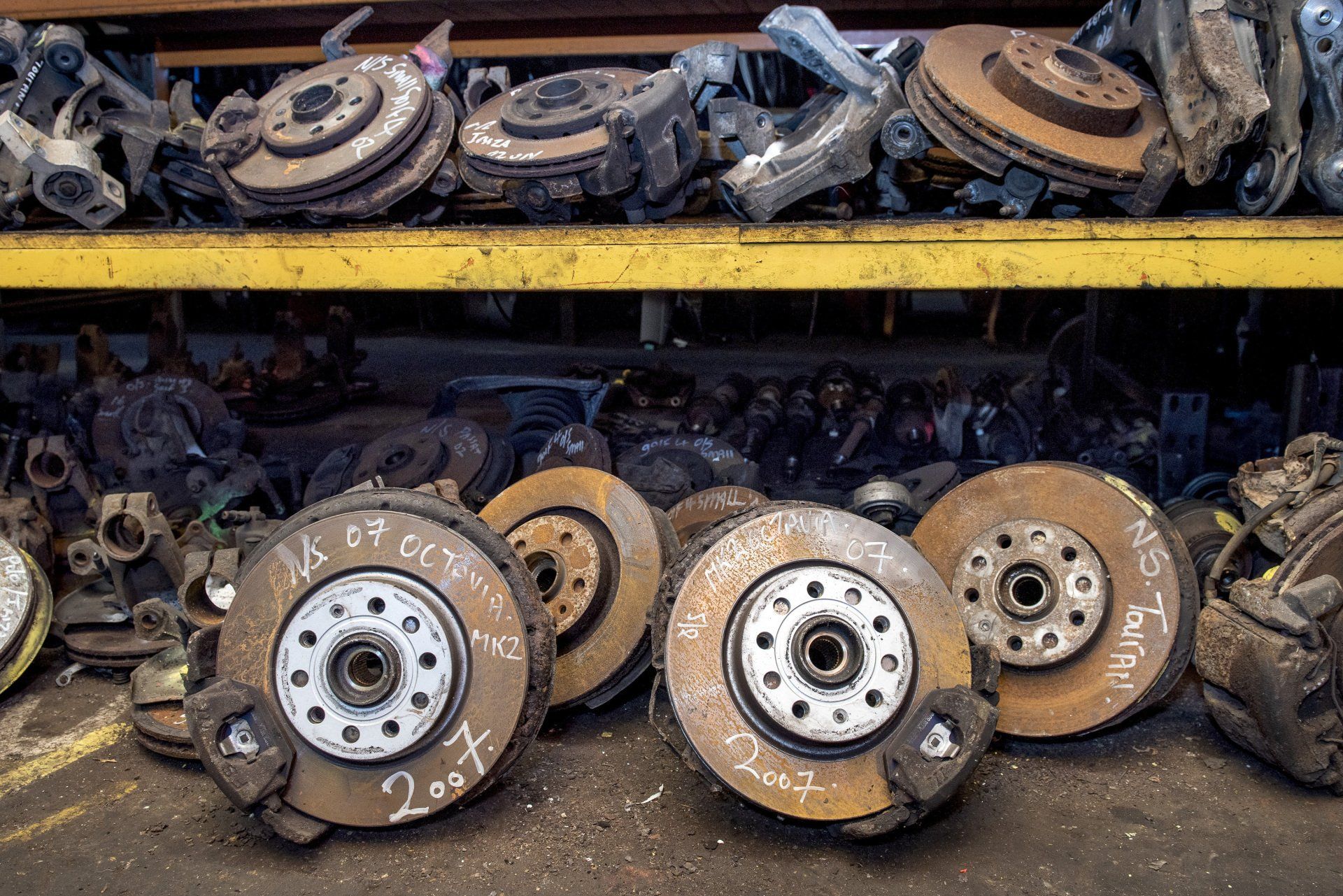 Lots of old rusty car break pads and disks