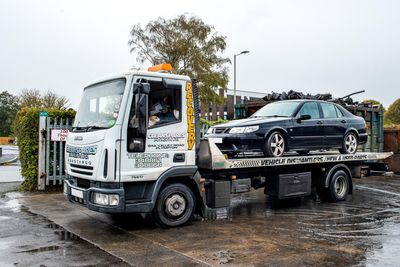 recovery truck with car on the back